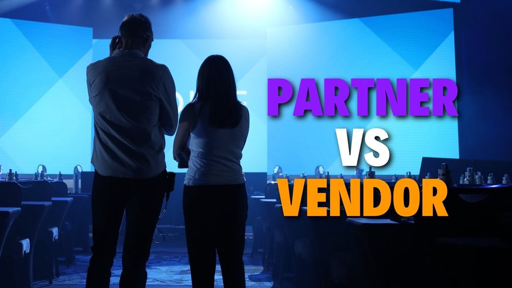 Two People Standing On The General Session Floor Partner VS Vendor