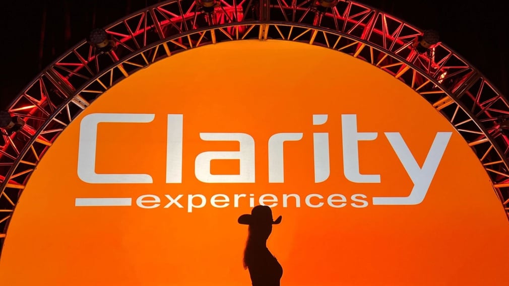 Silhouette Of Person In Front Of Clarity Experiences General Session Backdrop